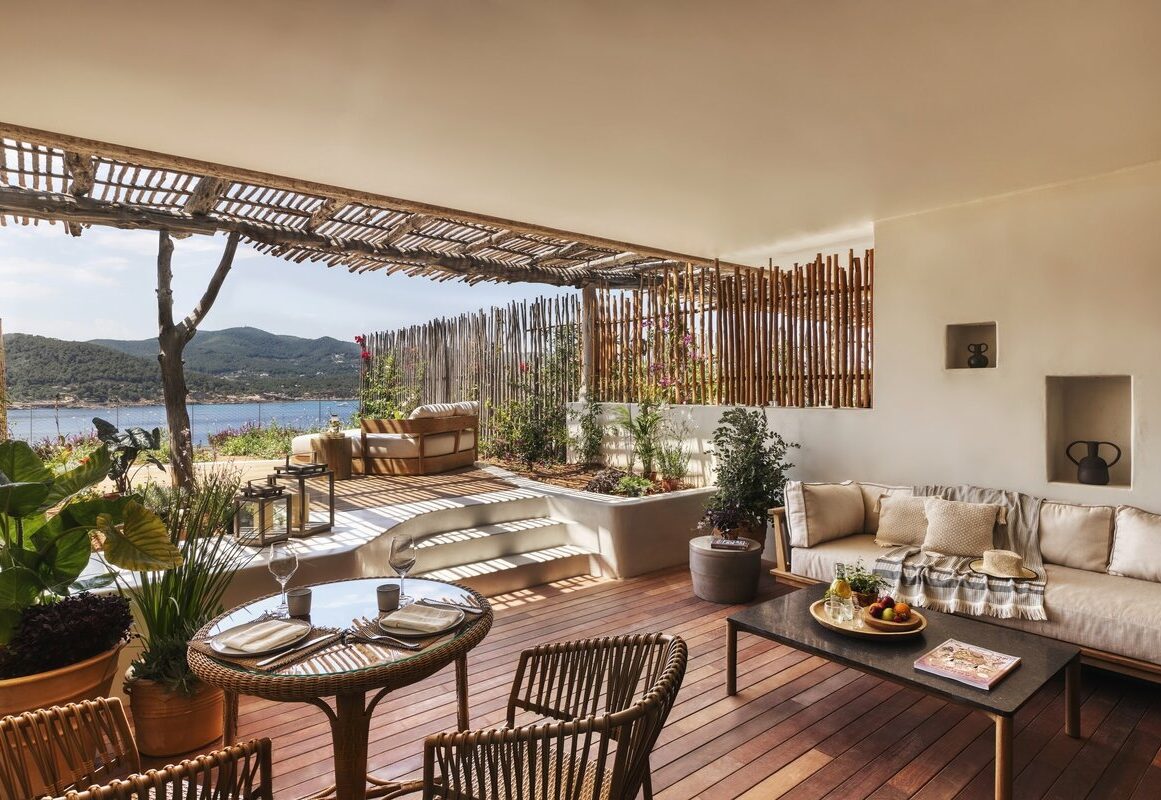 a patio with a table and chairs