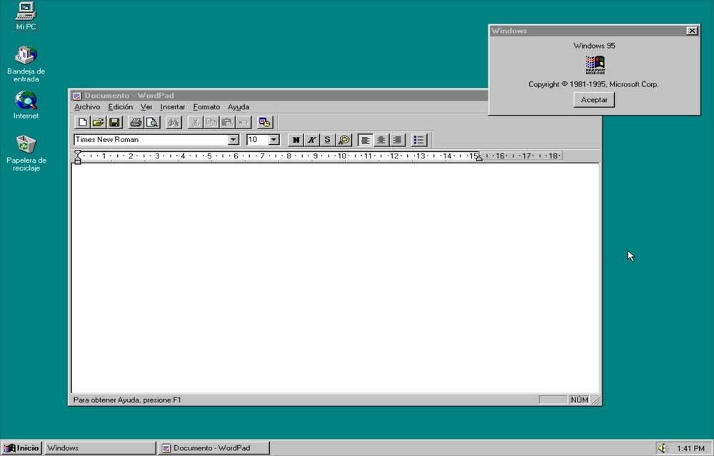Escritorio de Windows 95 en español con el procesador de textos WordPad y la ventana de información del sistema abierta.