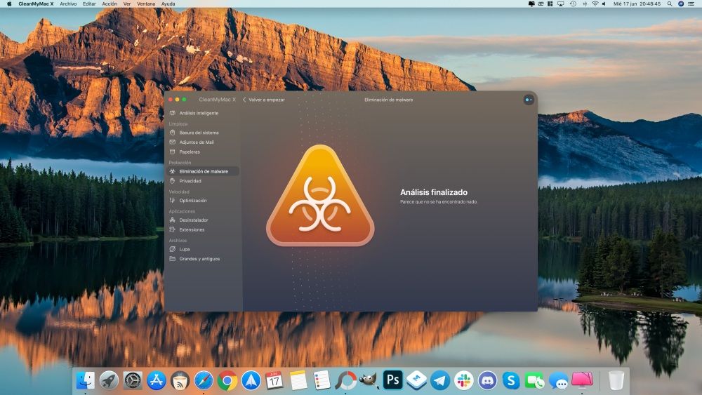 Interfaz de CleanMyMac X en macOS mostrando el resultado de un análisis de eliminación de malware sobre un fondo de pantalla de montañas y un lago.